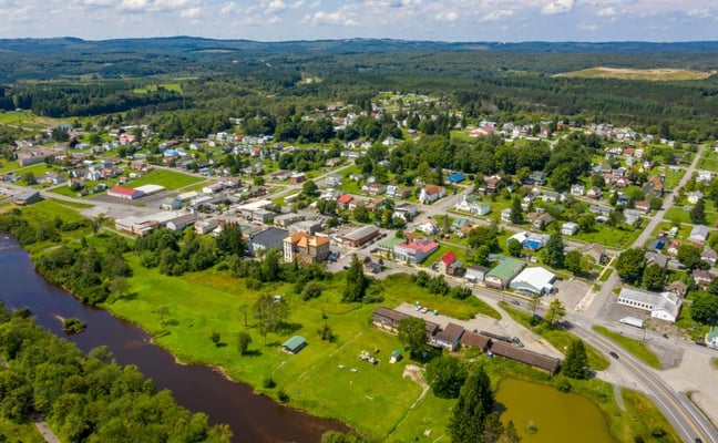 Aerial view of Davis, WV with the Blackwater River running alongside the town in summer