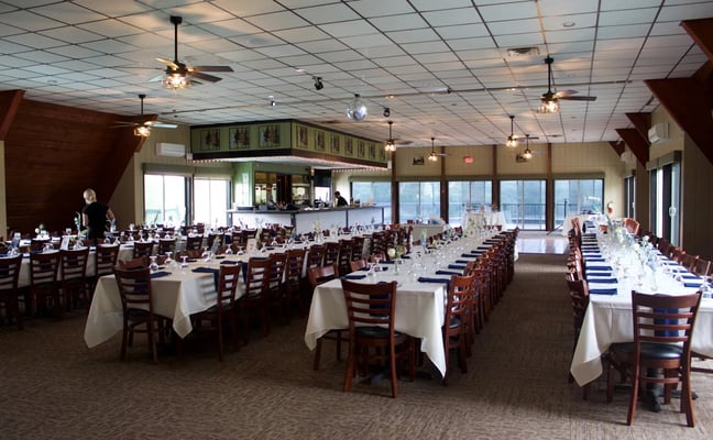 La Tavola dining room at Alpine Lake Resort set for a large event with white linens and lake views